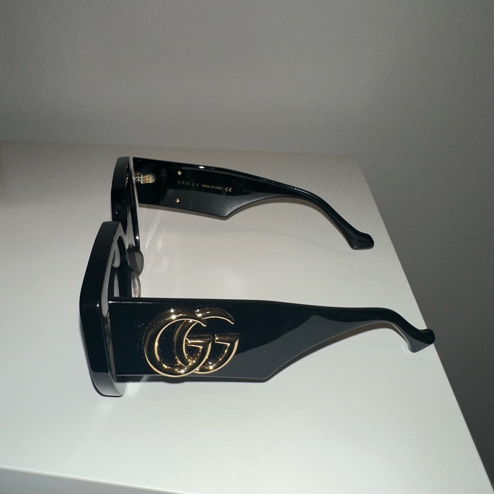 Gucci Glossy Black Sunglasses with Gold Emblem
